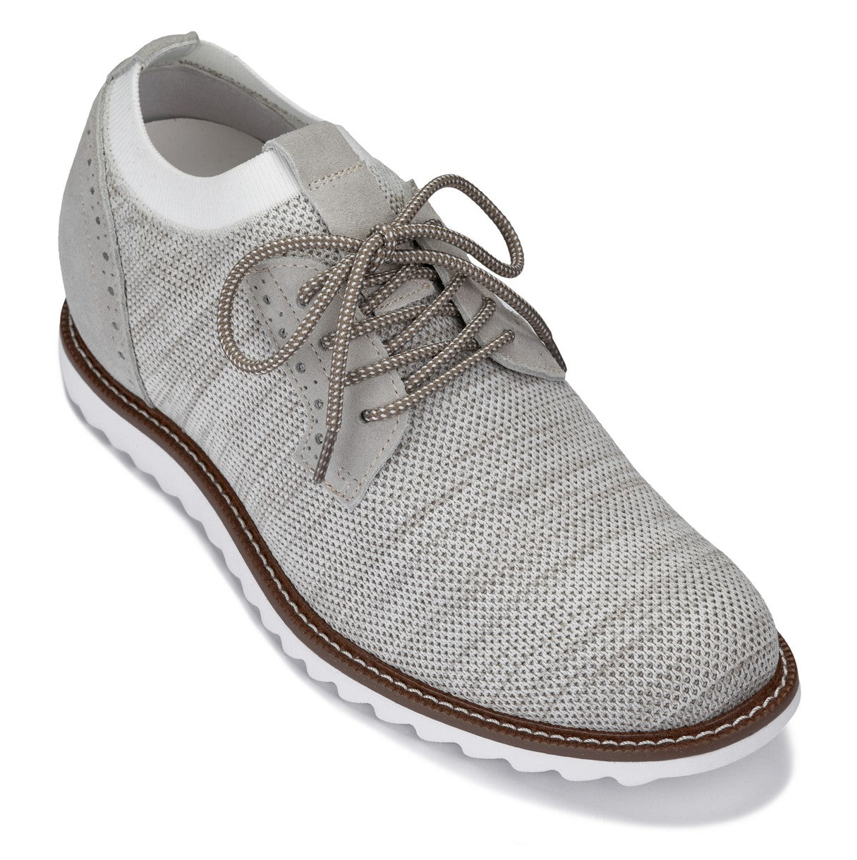 White sneaker with brown sole on a white background