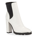 White ankle boot with black block heel and sole on a white background
