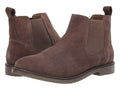 Pair of brown suede Chelsea boots on a white background