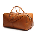 Brown leather duffel bag with gold hardware on a white background
