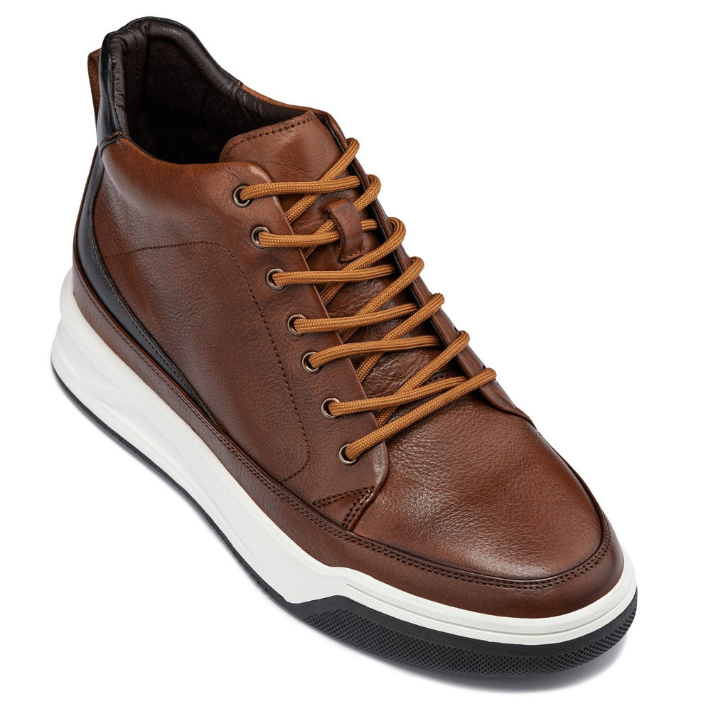 Brown leather sneaker with white sole on a white background